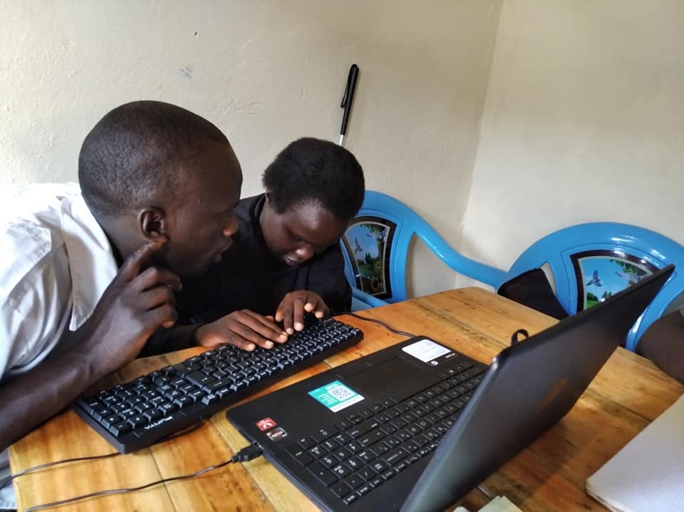 Picture of visually impaired students using a computer